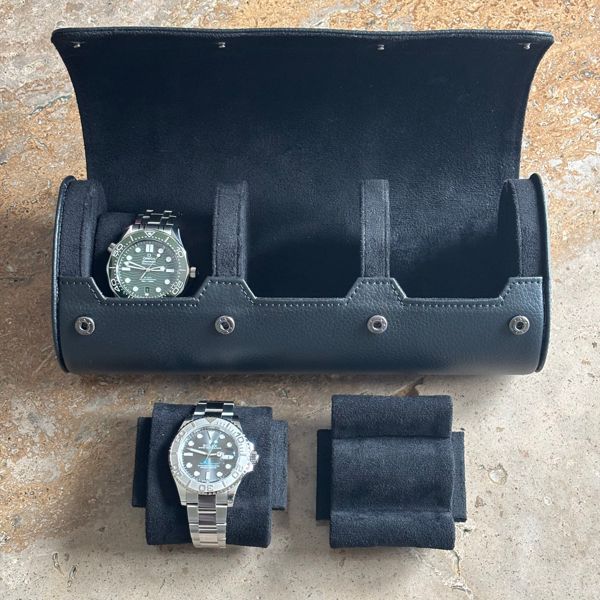 Inside the ASCATI watch roll showing a watch and precision fit cushions from front and back